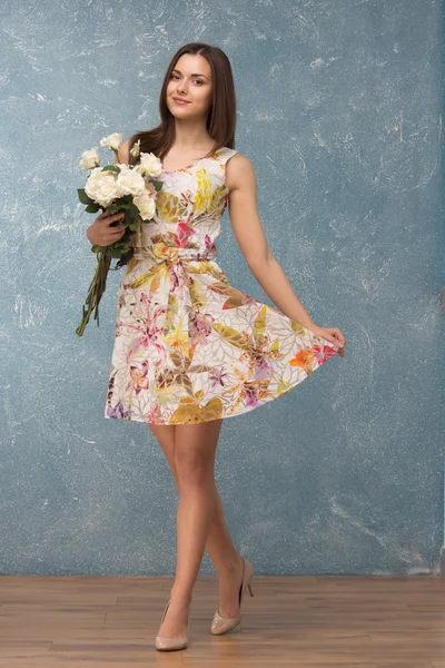 Girl with bunch of flowers — Stock Photo, Image