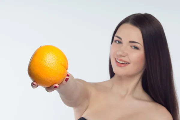 Girl and orange — Stock Photo, Image