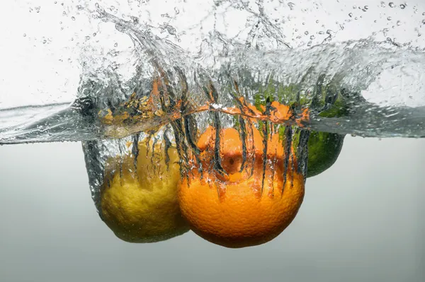 Fresh swimming fruits and vegetables — Stock Photo, Image