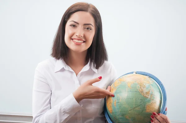 Business woman with the globe Stock Image