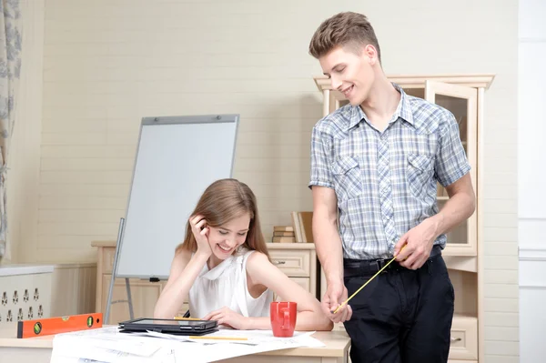 Two young architectures working at projective drawing — Stock Photo, Image