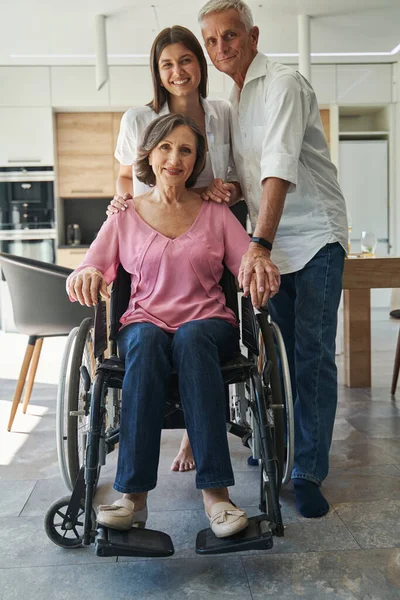 Male person hugging and holding hand of female — Stock Photo, Image