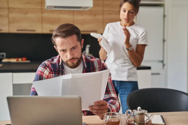 Concentrated seriously male working with contract from home office — Stock Photo, Image