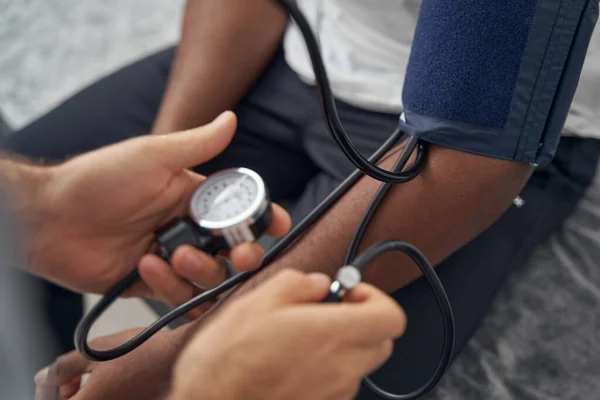 African American patient undergoing routine medical check-up — Stockfoto