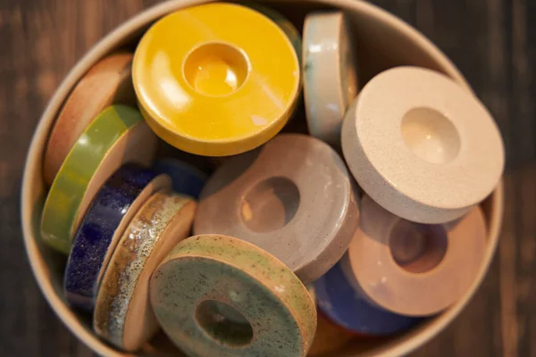 Set of round colorful glazed ceramic candle-holders — Stock Photo, Image