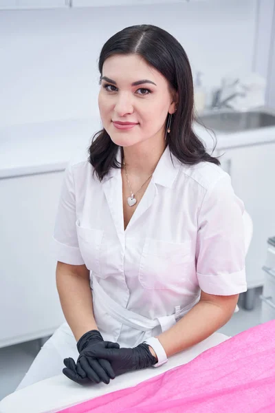 Positive delighted female person working in beauty clinic — Stock Photo, Image