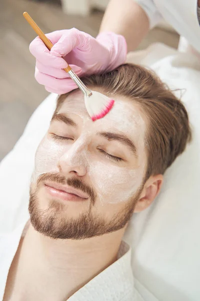 Close Photo Man Face Undergoing Skin Mask Treatment Getting Covered — Stock Photo, Image