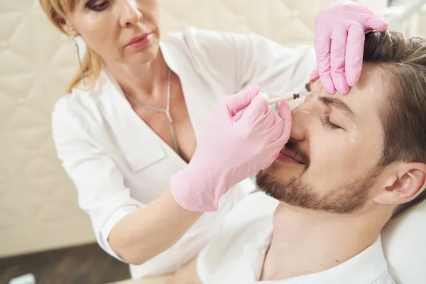 Female Medical Worker Making Prick Male Forehead Injecting His Skin — Stock Photo, Image