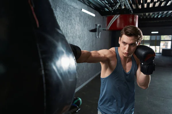 Waist Portrait Strong Muscular Man Boxing Gloves Hitting Punching Bag — Stock Photo, Image