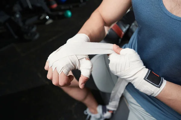 Cropped Photo Professional Sportsman Wrapping Elastic Bandage His Right Hand — Stockfoto