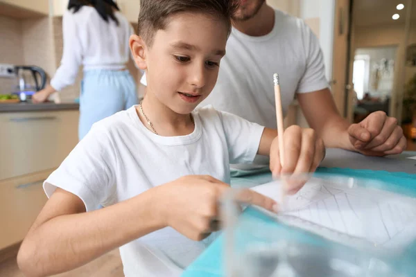 Child Preparing His Hometasks School Notebook Dining Table Father Mother — ストック写真