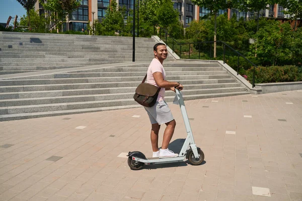 Smiling Happy Adult Man Placing His Right Leg Electric Scooter — Stock fotografie