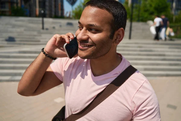 Portrait Pleased Man Bag Shoulder Standing Outdoors Phone Conversation — Stock Photo, Image