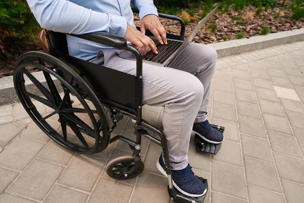 Cropped Photo Disabled Man Seated Wheelchair Working Portable Computer — Stock Fotó