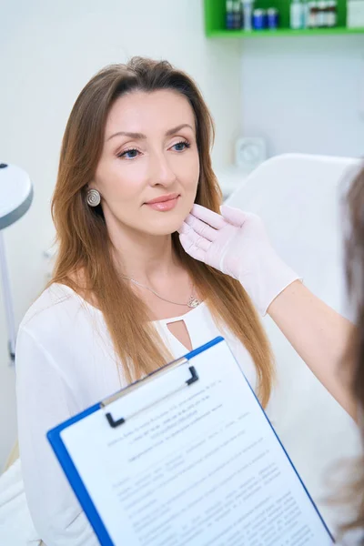 Doctor Gloves Medical Card His Hands Examines Patient Face — 图库照片