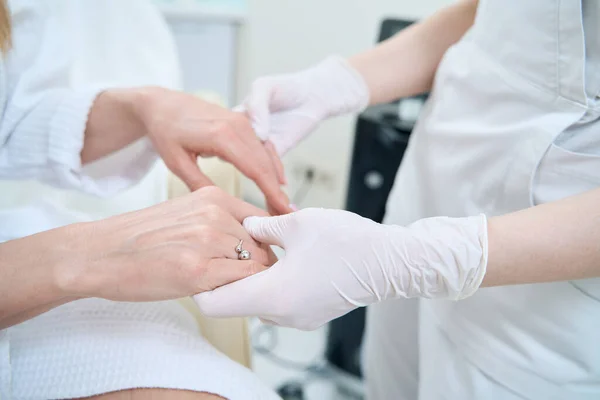 Woman Doctor Examining Skin Wrists Female Client Aesthetic Medicine Clinic — Fotografia de Stock