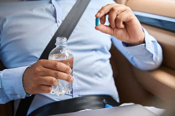 Cropped Photo Car Passenger Fastened Seat Belt Holding Drug Capsule — Stockfoto