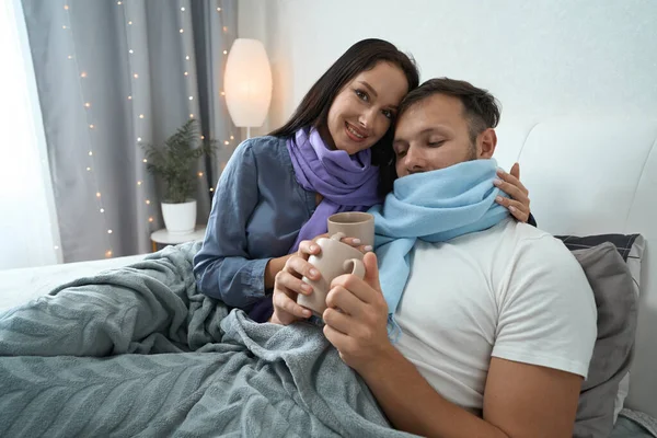 Young Couple Malaise Bed Holidays Guy Female Drink Healing Tea —  Fotos de Stock