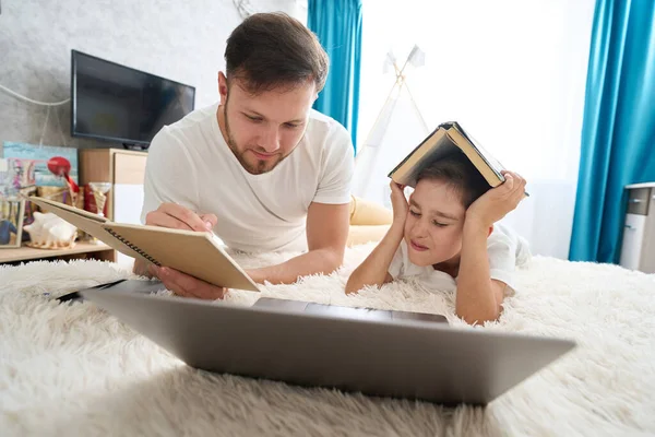 Caring Young Father Helps His Son Correct Homework Use Laptop — 스톡 사진