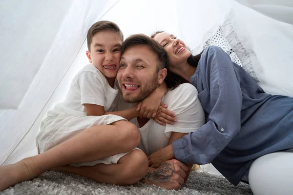 Cheerful Family Hugs Dad Mom Son Cozy Fabulous Hut —  Fotos de Stock