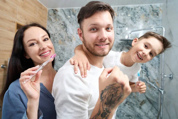 Family Three Cheerfully Brushes Teeth Bathroom Mom Dad Son Have — Photo