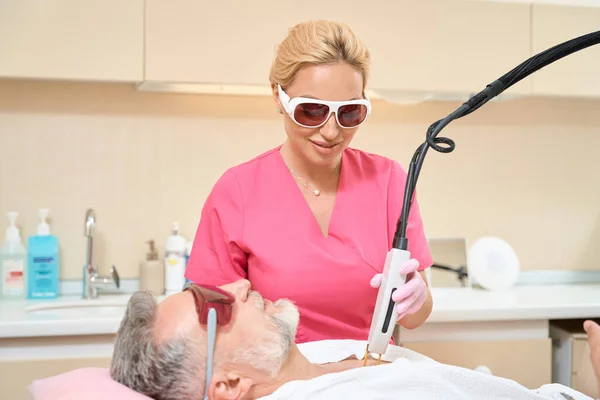 Woman Dermatologist Glasses Doing Laser Hair Removal Man His Chest — Foto de Stock