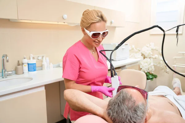 Smiling Female Dermatologist Glasses Doing Laser Hair Removal Man Armpit — 스톡 사진