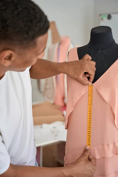 Young Male Dressmaker Using Tape Measurer Fabric Mannequin Sewing Clothes — ストック写真
