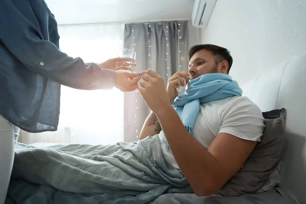 Guy Scarf Takes Medicine Flu Carefully Served Glass Water Bitter — стокове фото