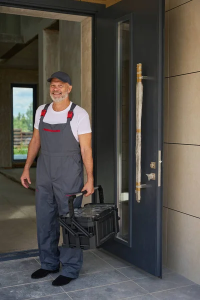 Portrait Adult Smiling Builder Overalls Tool Box Man Stands Front — ストック写真