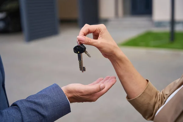 Female Hand Puts Male Palm Keys House Countryside Close Photo — Stock fotografie