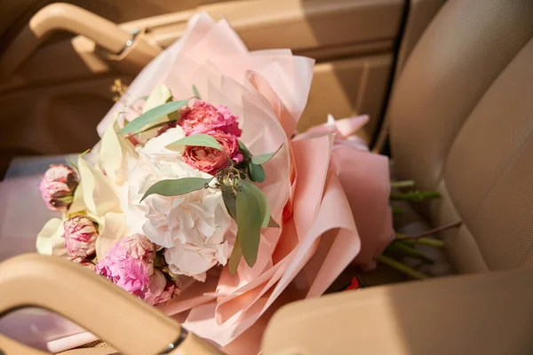 Close Beautiful Bouquet Peonies Hydrangeas Lies Leather Car Seat Order — Photo