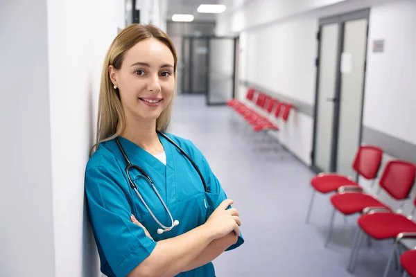 Adult Female Doctor Stands Corridor Hospital Smiles While Looking Camera — Foto Stock