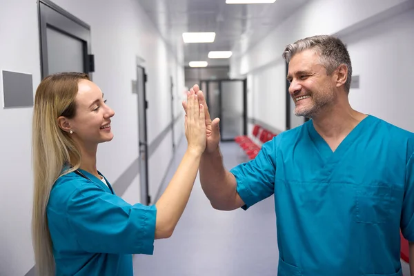 Two Smilling Happy Doctors Give Each Other High Five — Foto Stock