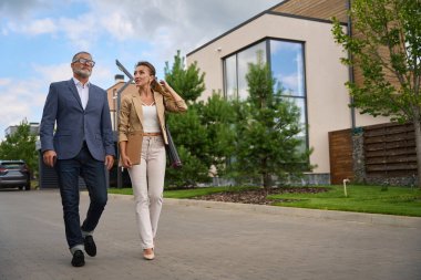 Female realtor met with a client for a home showing. Buying a property