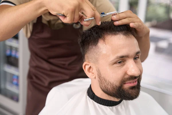 Joyous Young Man Smiling While Enjoying Hairstyle Appointment Local Barbershop — Stock Photo, Image