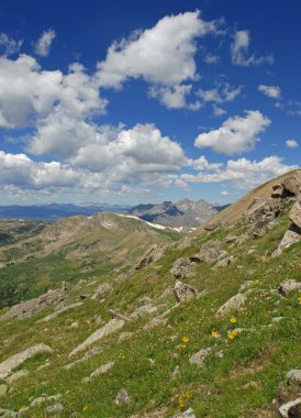 Hiking in the Rocky Mountains with Blue Sky and Clouds clipart