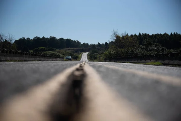 Highway in the interior of Brazil. Asphalt road with little movement. Rural landscape on highway in Brazil. Feeling of freedom. Reflection and self-knowledge.