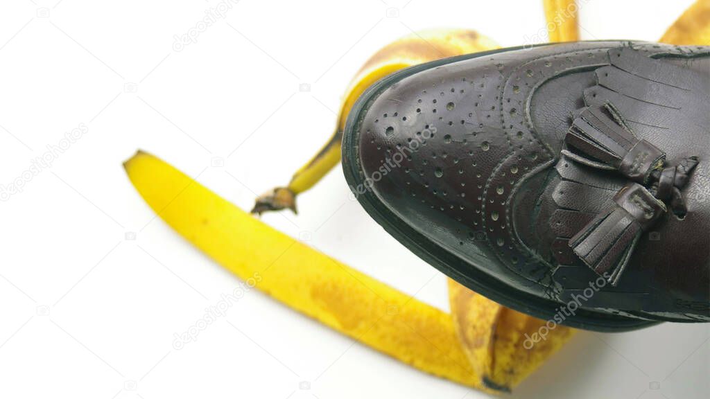 A Selective Focus image of Foot stepping on banana peel