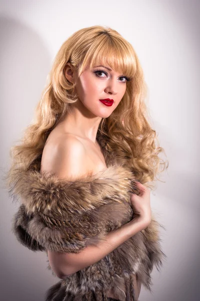 Model posing in fur vest — Stock Photo, Image