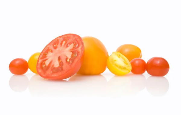 Colourful tomatoes with reflection — Stock Photo, Image