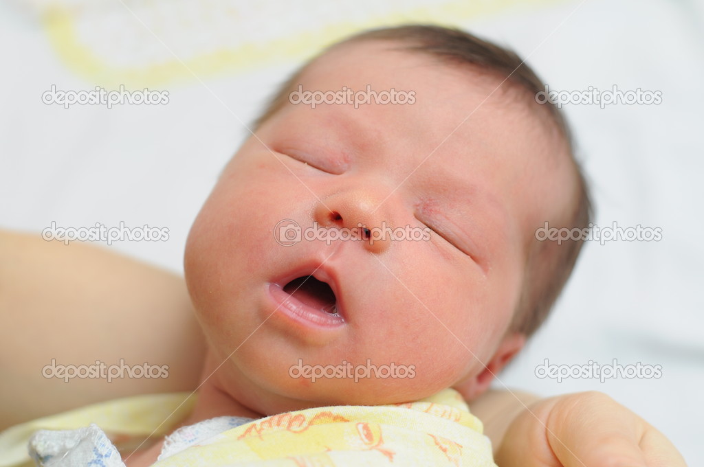 Baby sleeping with his mouth open