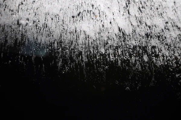 Fondo abstracto con burbujas de aire congeladas en hielo en la espalda negra —  Fotos de Stock