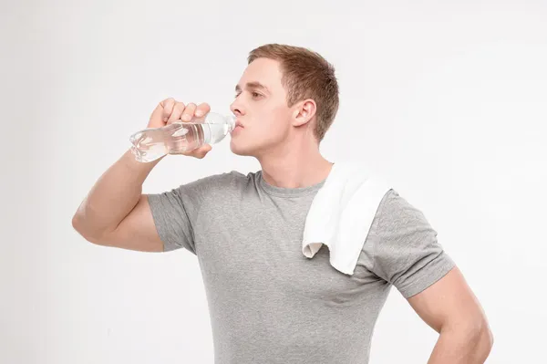 Athlete after workout with a water bottle — Stock Photo, Image