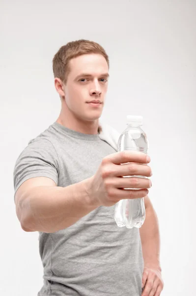 Athlete after workout with a water bottle — Stock Photo, Image