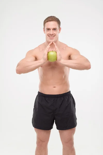 Atleta con una manzana —  Fotos de Stock