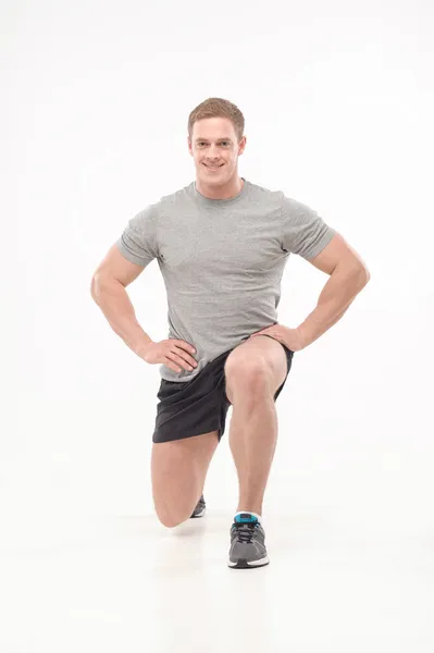 Man doing squats — Stock Photo, Image