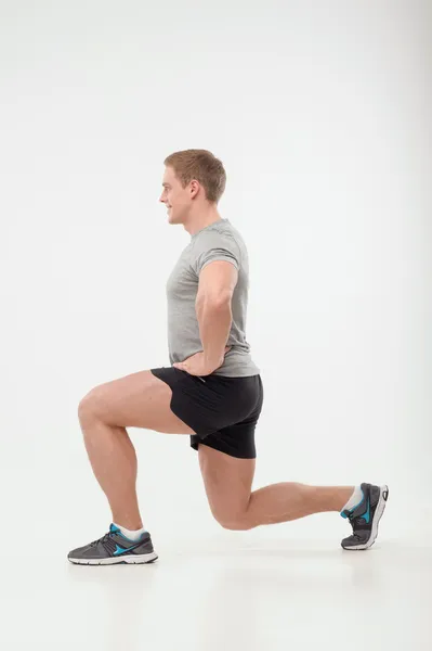 Man doen squats — Stockfoto