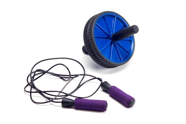 Exercise Roller and violet skipping rope — Stock Photo, Image