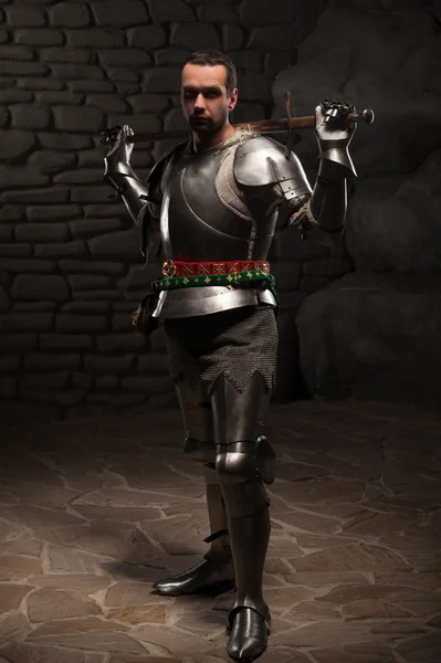 Medieval Knight posing with sword — Stock Photo, Image